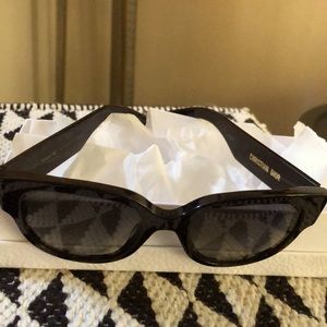 Authentic women’s black sunglasses.new in box